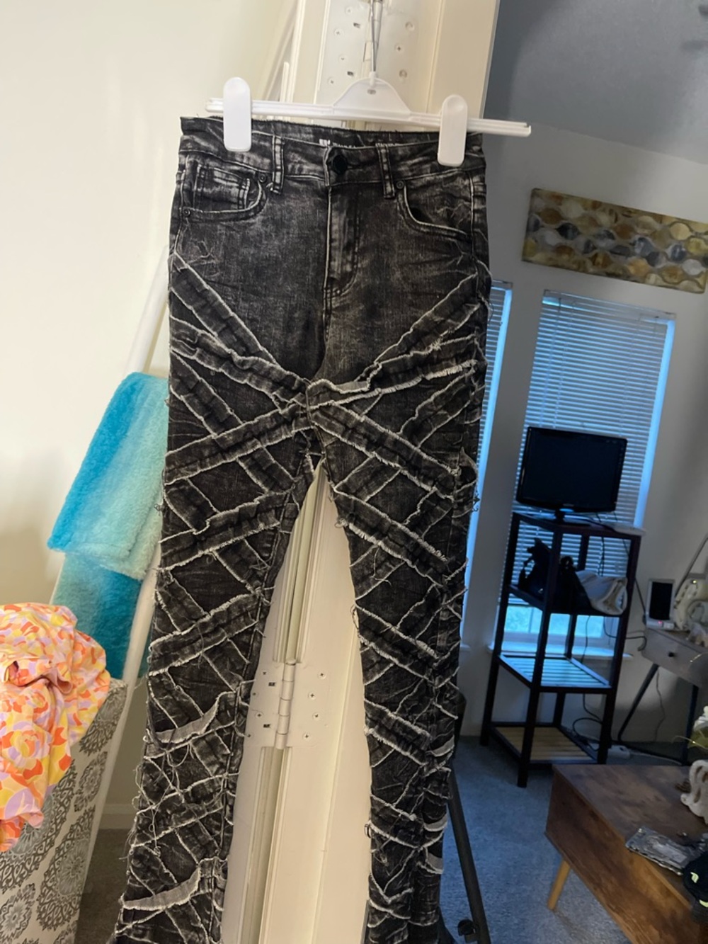 Black Acid-Wash Jeans with White Distressed Crisscross Detail